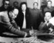 China: Guo Moruo (1892-1978, right), Chinese author, historian and intellectual, watching tha artist Pan Tianshou (1897-1971, left) creating a painting, 1957
